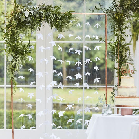 White origami flower backdrop 